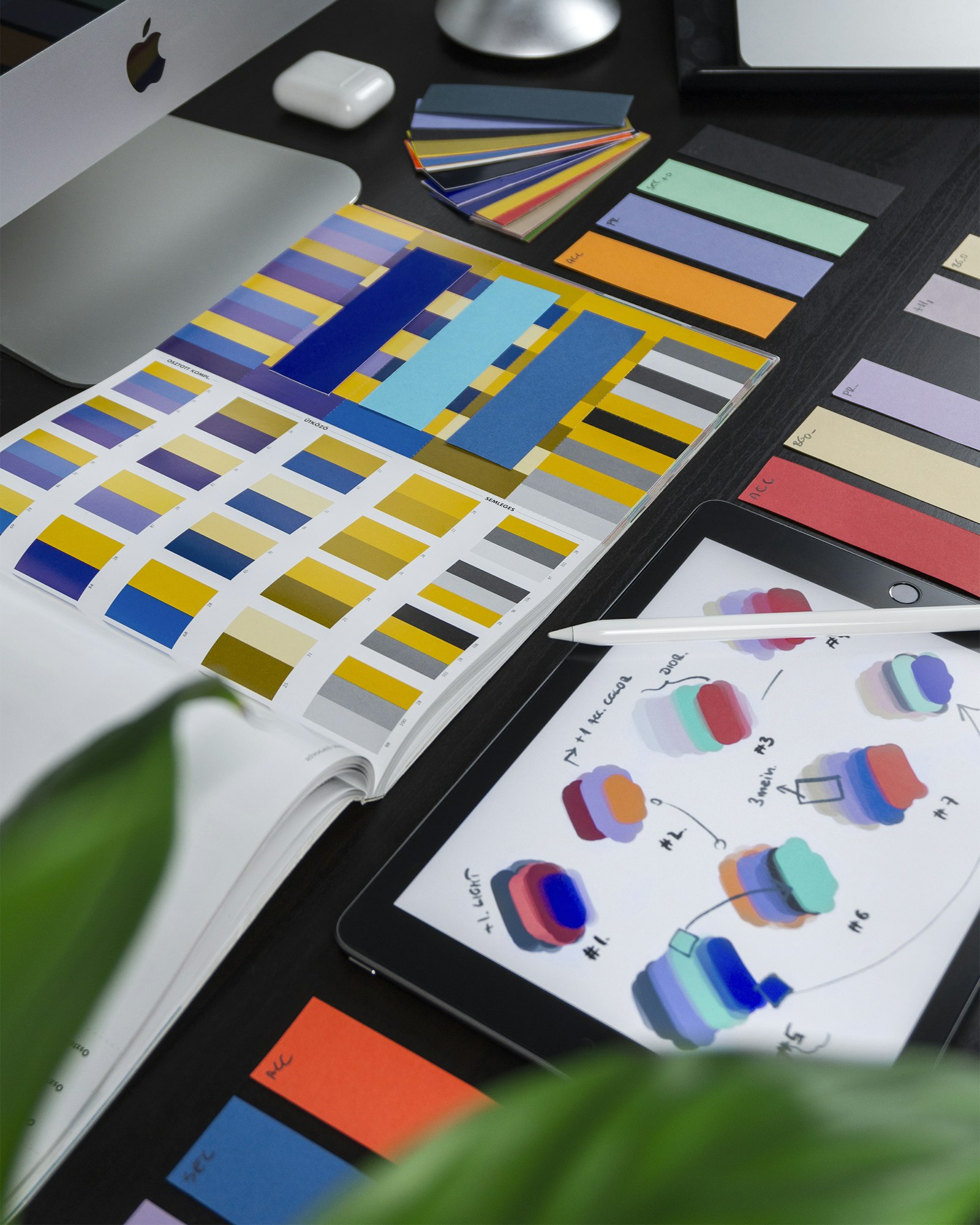 Designer workstation with colour swatches and brand work