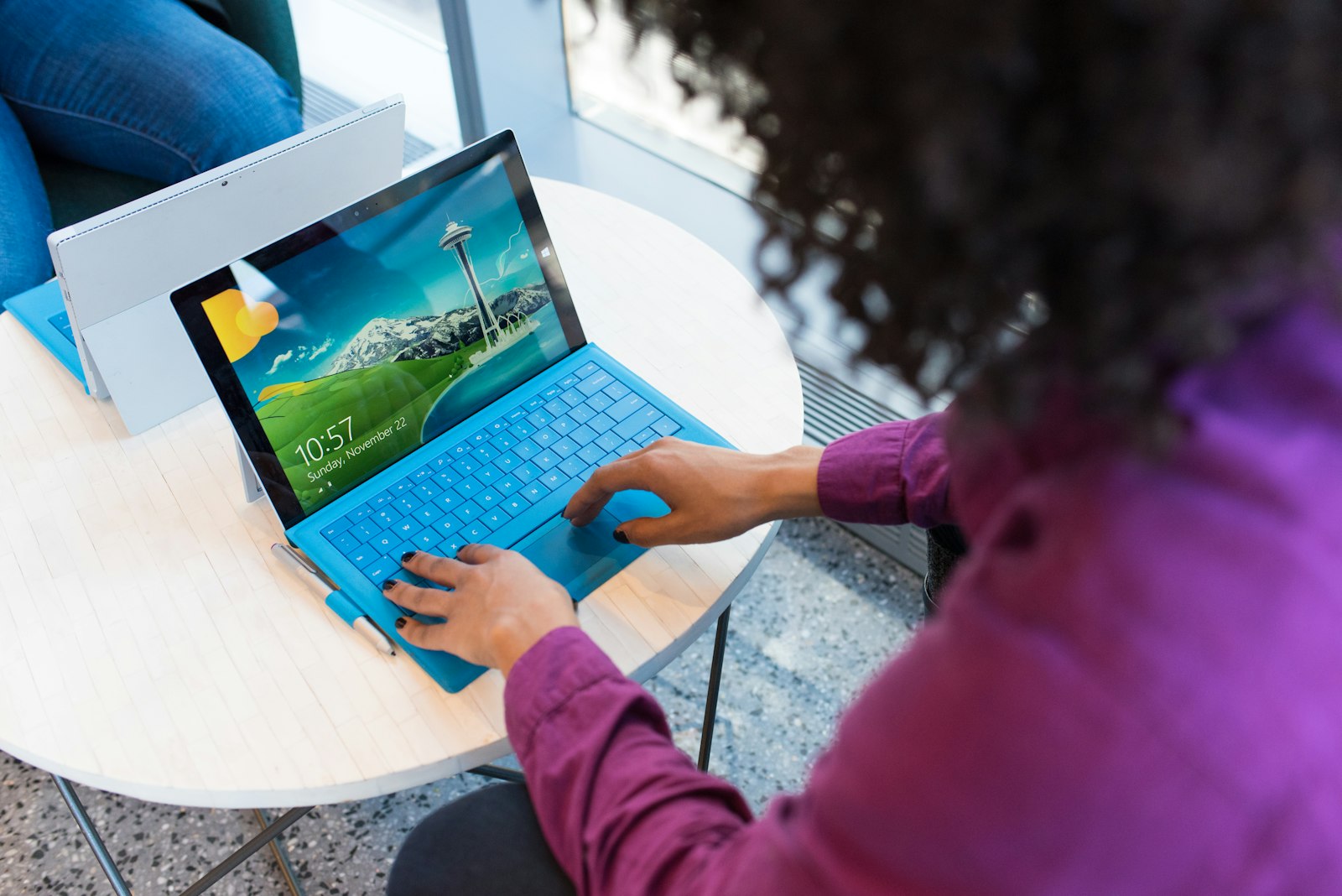 Professional working on a laptop in a modern workplace