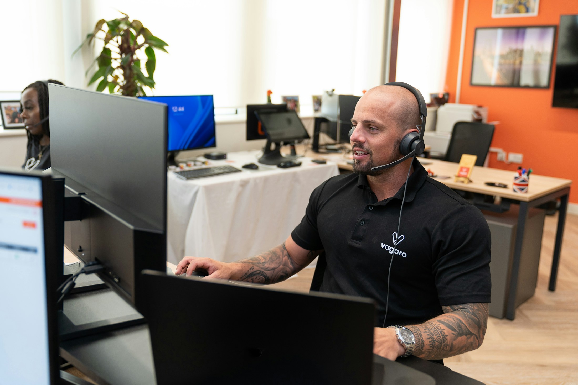Support professional working at a helpdesk workstation